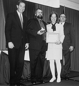 Mike Porter receives Outstanding Community Service Award from Governor Tony Knowles and AWB President.